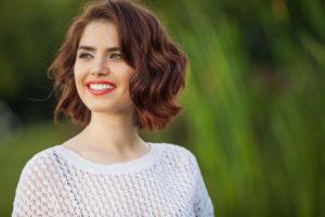 smiling woman with bob haircut
