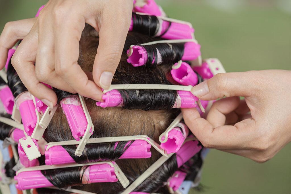 Woman with perm rollers